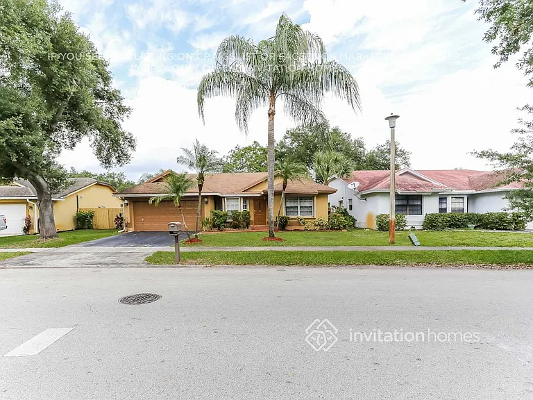 9575 NW 25th Ct — Photo 2