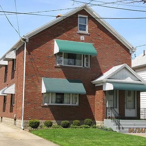 Brick Exterior/metal awnings