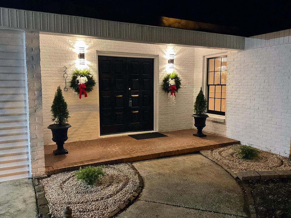 Beautiful covered front porch with double door entry.