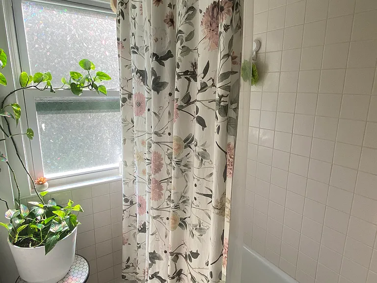 Tiled bathtub/shower - window