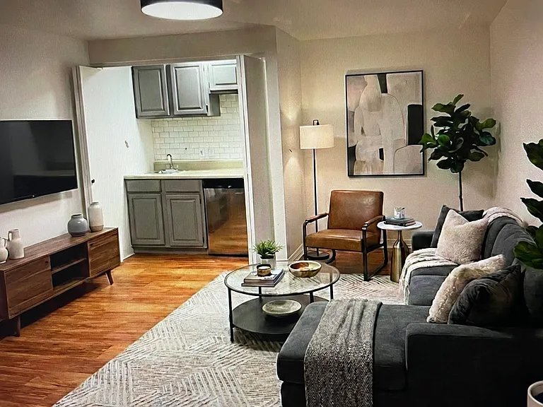 Bonus room in basement with wet bar and small fridge virtually staged