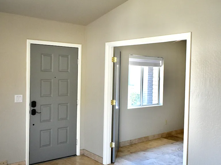 View of the front door and double-door entry to the 3rd Bedroom/Den/Office/Game Room.