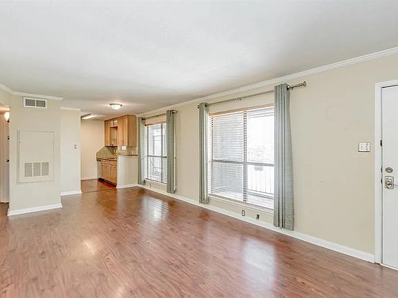 Living room with view of kitchen
