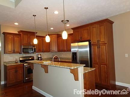 Kitchen
						:
						Stainless steel appliances, cherry cabinets
