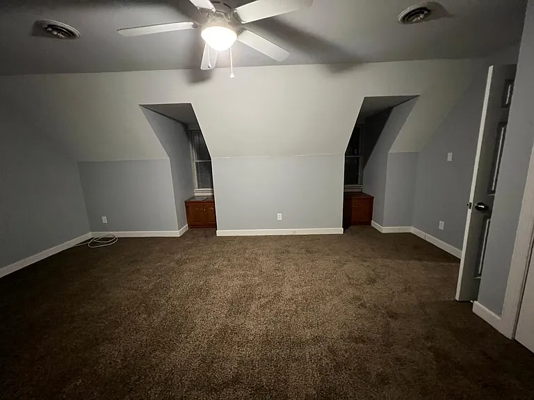 Bedroom 3, 2 windows shown face the front of the home