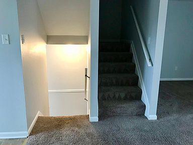 Staircase leading to upstairs bedrooms and downstairs finished basement
