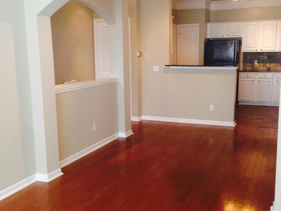 Fully upgraded with wood floors, triple crown molding, and arched walls.