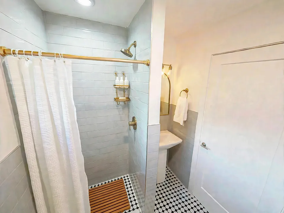 Full bathroom with walk-in shower. (Furnished for display)