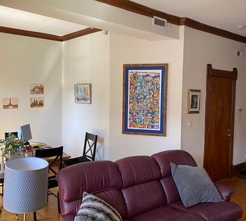 Living room with den area for dining table or office