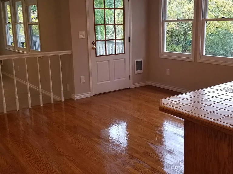Dining area- with mountain views door to wraparound covered porch and access to outdoor brick patio/BBQ area and sport court access.