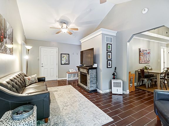 Vaulted ceiling in the family room w/ electric fireplace