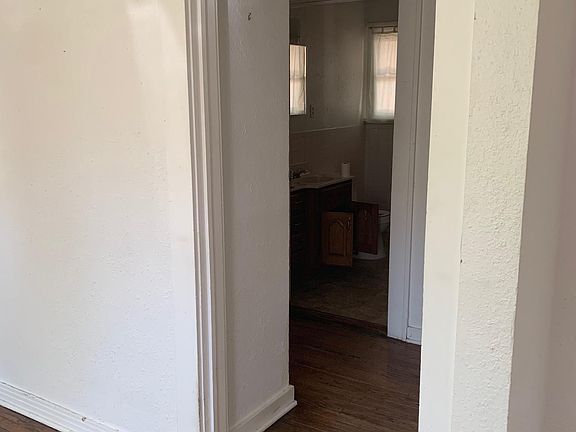 hallway connecting living room to bedrooms and bathroom