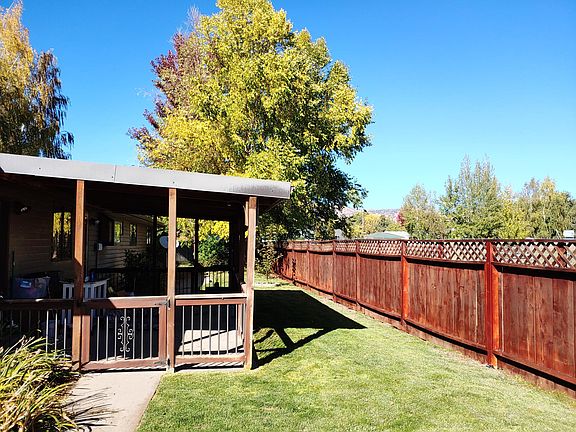 Fenced backyard and covered patio