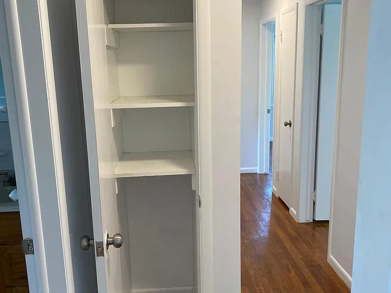 Hallway with Linen Closet Open