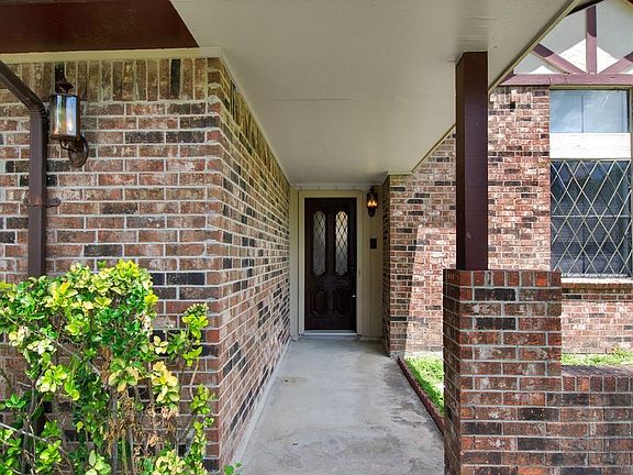 Beautiful covered space leading up to the front door.