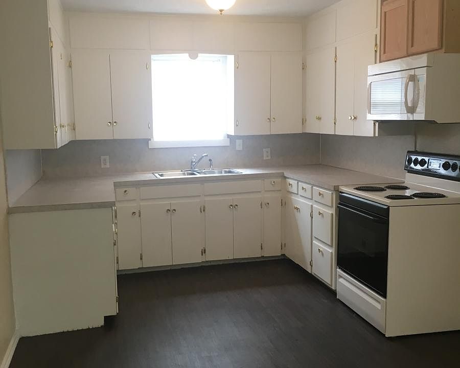 Kitchen with microwave and range