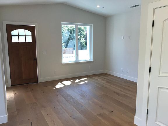 Spacious Living Room Entry With Vaulted Ceiling