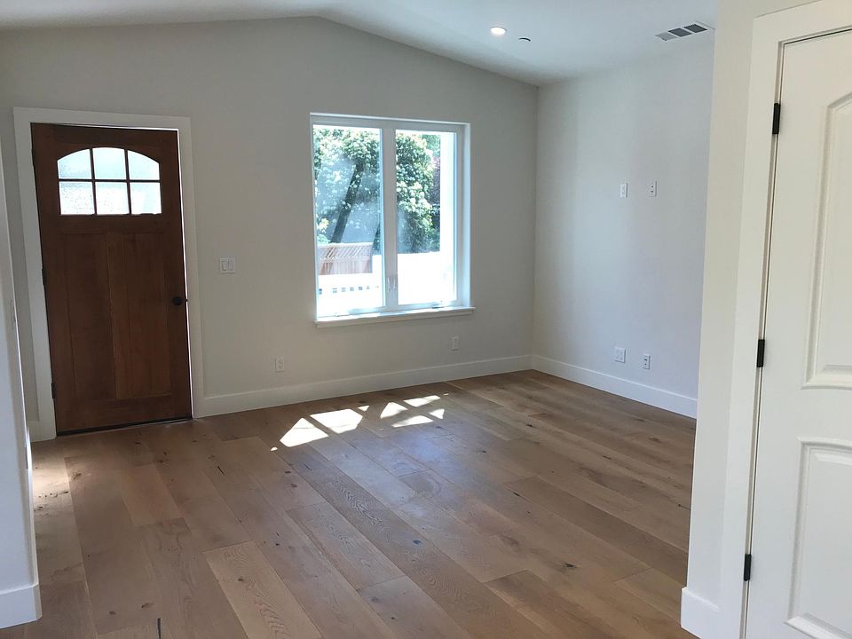 Spacious Living Room Entry With Vaulted Ceiling