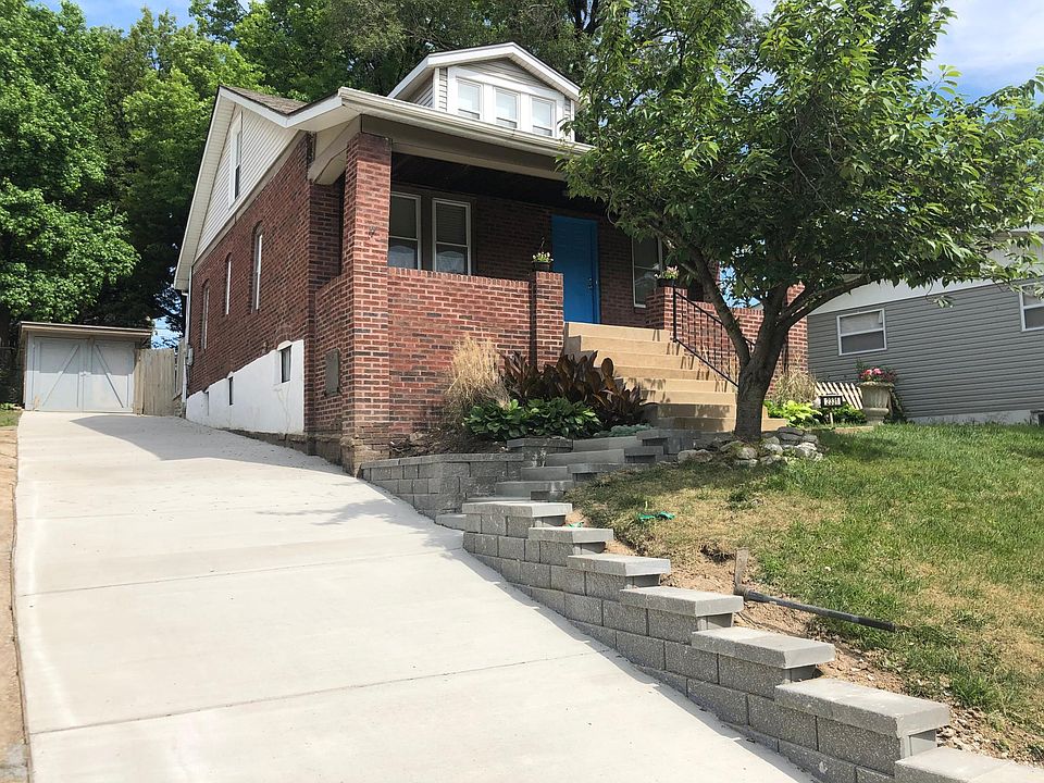 Front of House with New Driveway, Stairs, and Retaining walls!