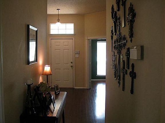 Expanse of Wood Floors in the large spacious entry.