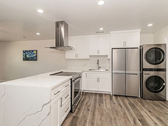 Luxury Kitchen and High End Appliances, LVP flooring, LED lighting.