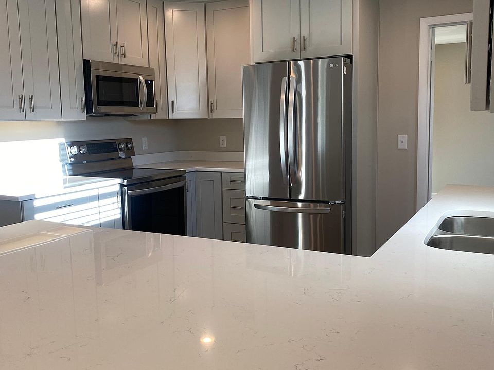 All new quartz countertops - shiplap peninsula, new stainless steel appliances, shaker slow close cabinets, recessed lighting, very nice!