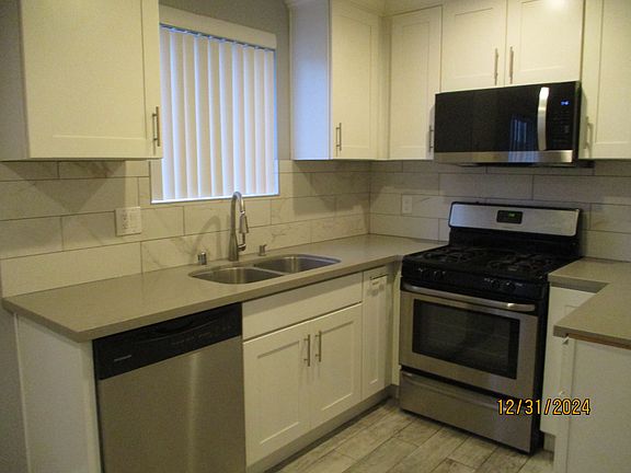 Newer stainless steel stove, microwave oven and dishwasher