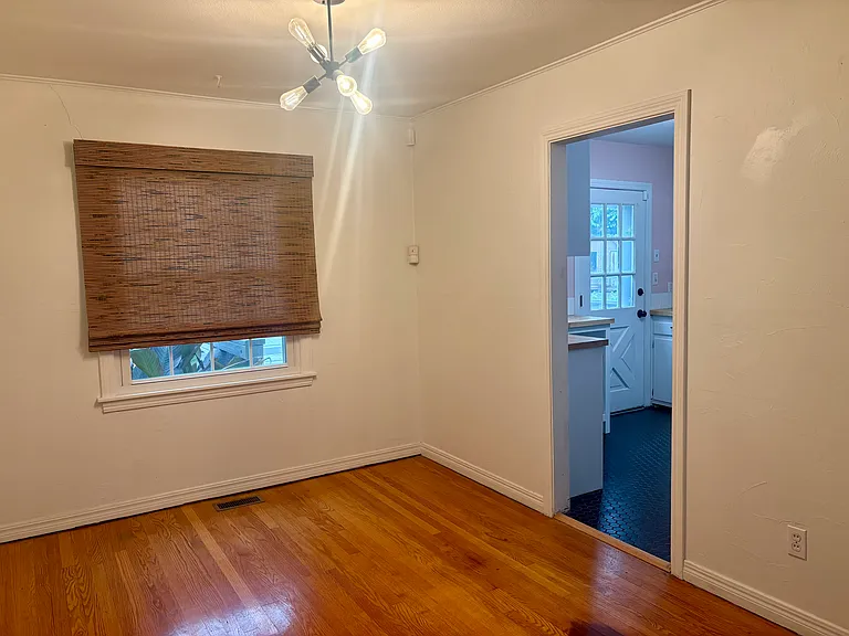Kitchen from dining room, updated fixtures.