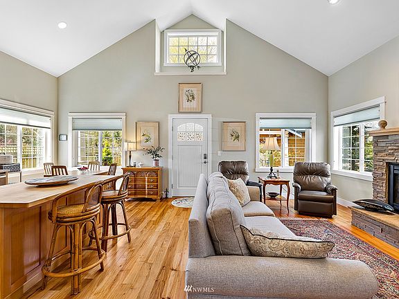 Vaulted ceilings, hardwood floors and open spaces are contemporary yet cozy