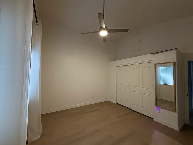 Secondary bedroom with ceiling fan and generous closet space.