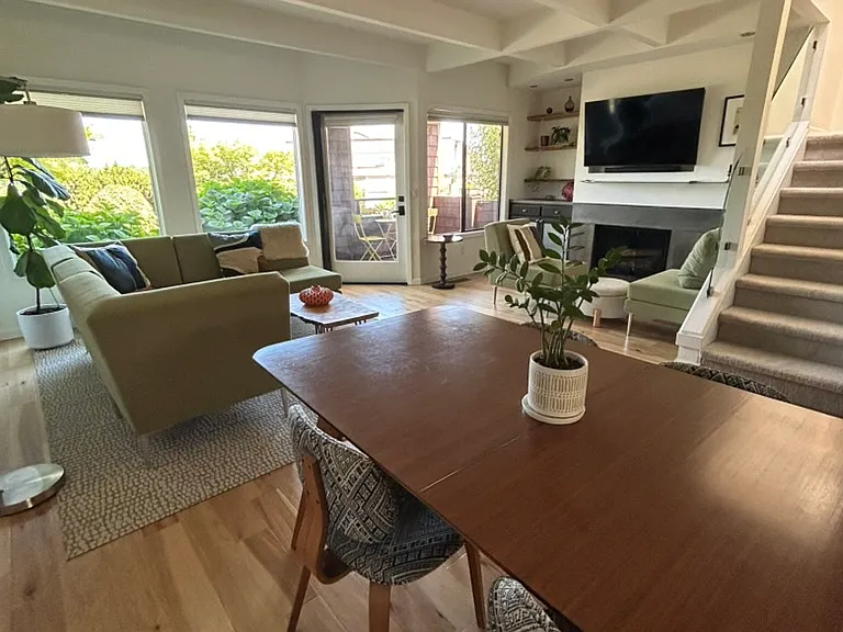 Dining and living area includes 55" Smart TV with soundbar