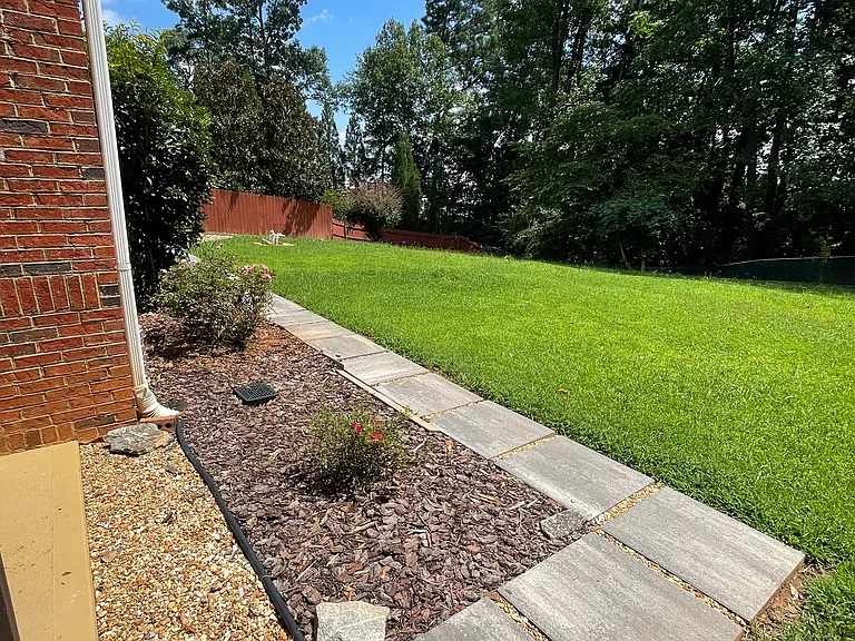 Backed by woods for added privacy in a quiet setting.