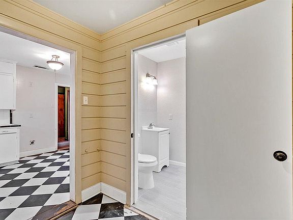 Hal bath is in the Utility Room, off the kitchen.