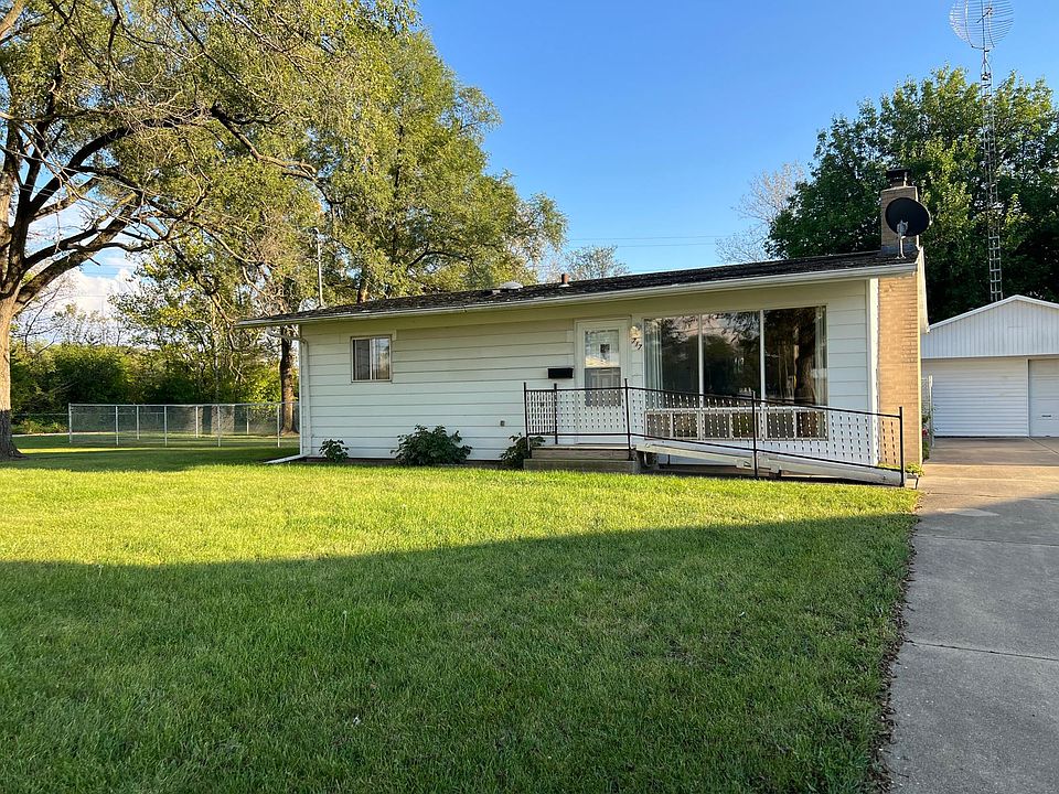 View of front yard & house with assisted walkway into front door of house