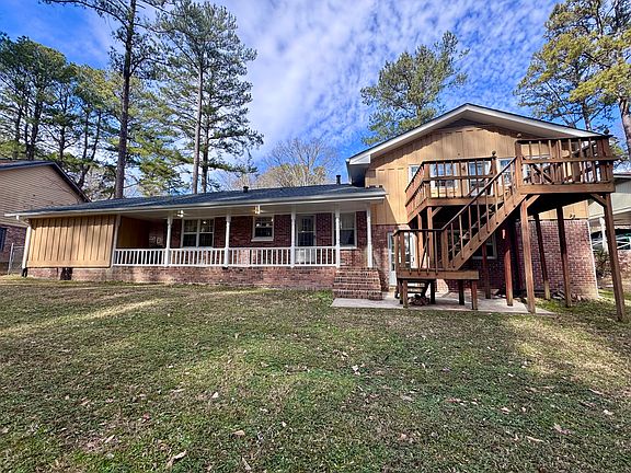 Back of the house with deck and patio, a perfect spot to entertain and rewind