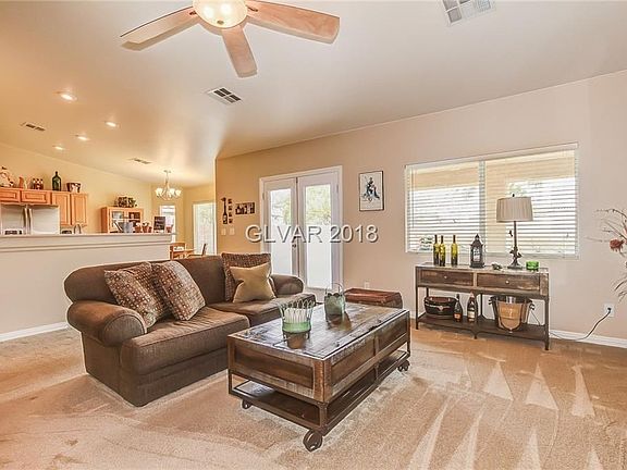 Great room with neutral carpet, upgraded pad, ceiling fan