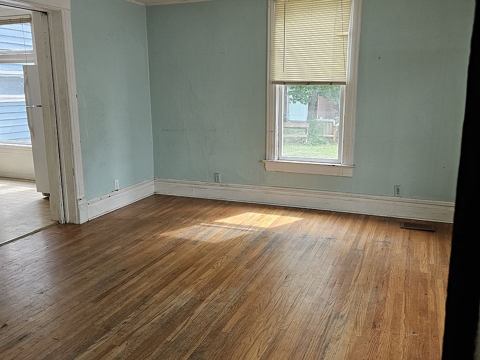 Living room with original hardwood flooring.