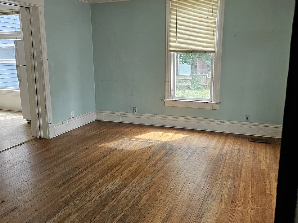 Living room with original hardwood flooring.