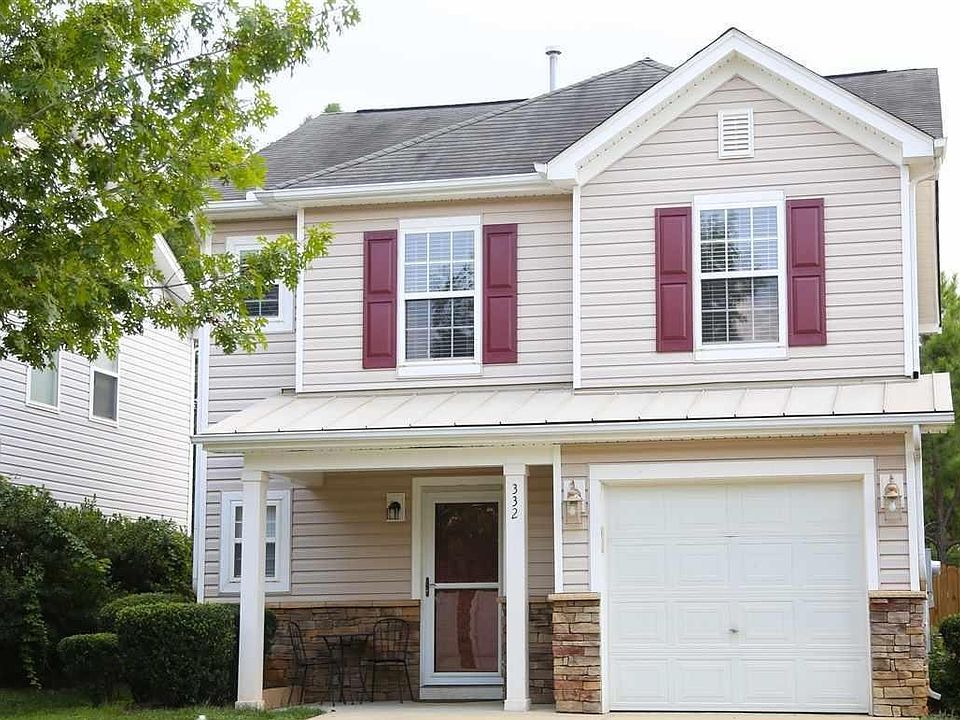 One car garage, double parking pad, covered porch.