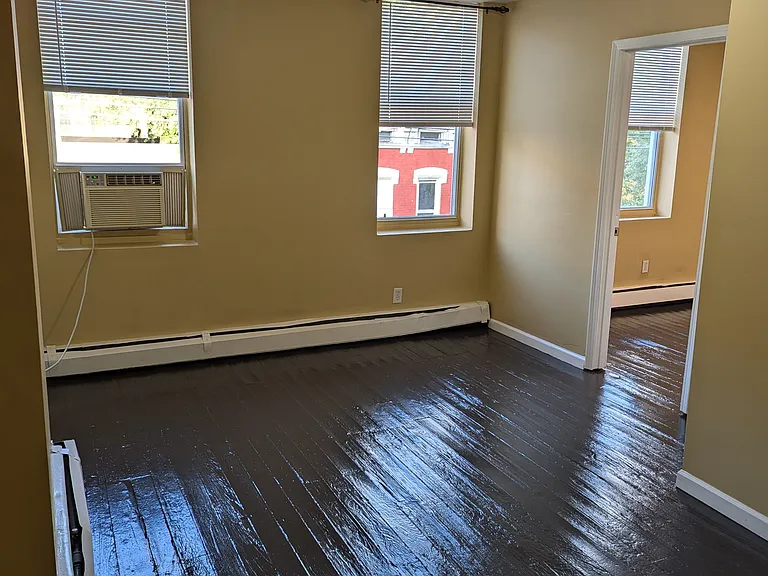 Living room (from kitchen hallway towards first bedroom)