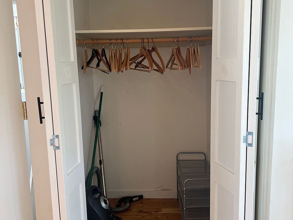Closet with vacuum cleaner and hangers