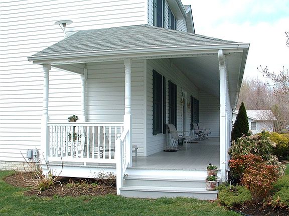 INVITING WRAP AROUND PORCH