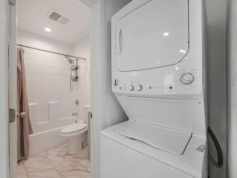Washer & Dryer leading into Bathroom