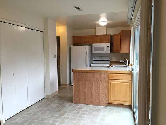 Kitchen, laundry; half bath to the left of the kitchen