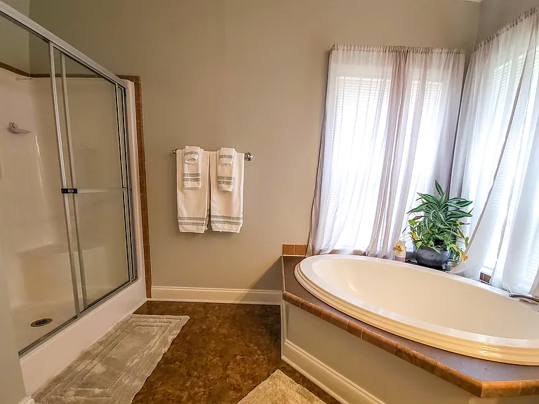 Master suite bath with large tub and walk-in shower