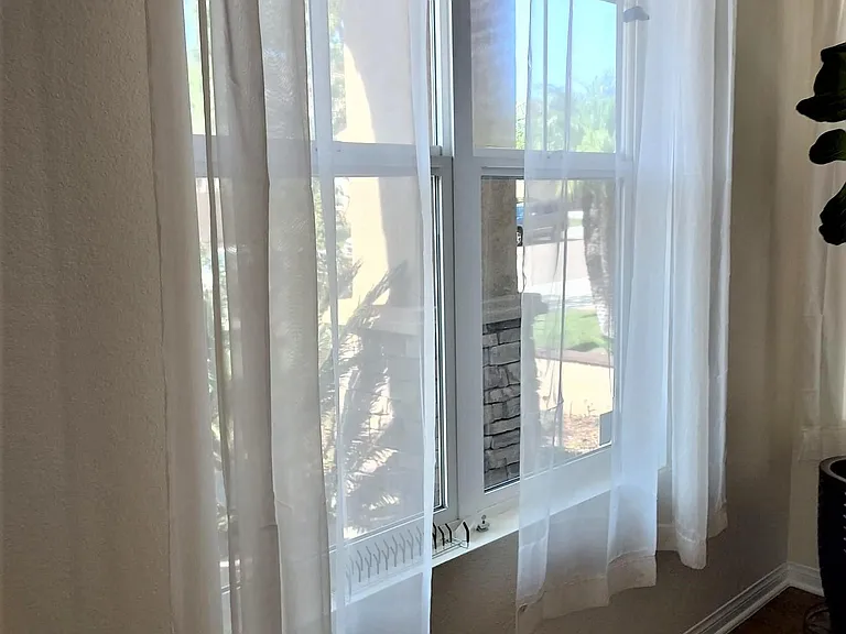 Living room windows facing Palomino Mesa Rd