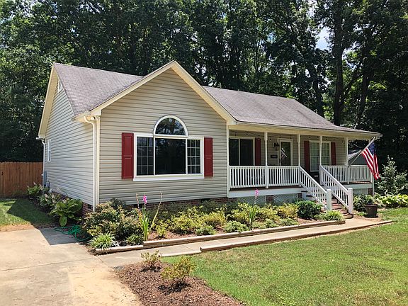 The front yard is beautifully landscaped.