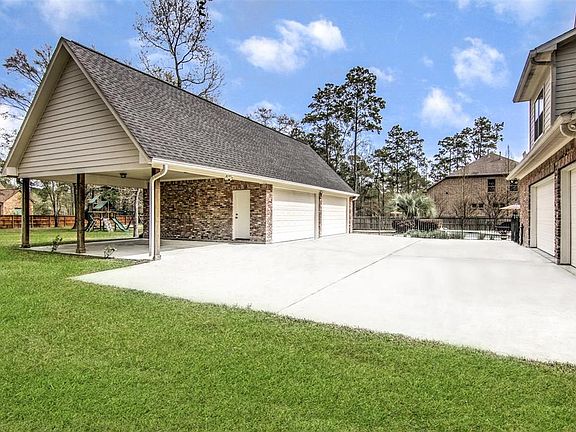 3 attached garages and 4 additional in the detached structure. Detached garage is wired for 220. Large carport with door to garage. Handy large concrete pad area between two structures.