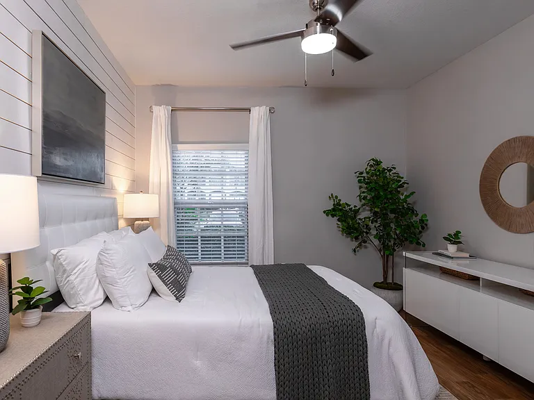 This thoughtfully crafted bedroom offers comfort and sophistication, perfect for unwinding after a long day.