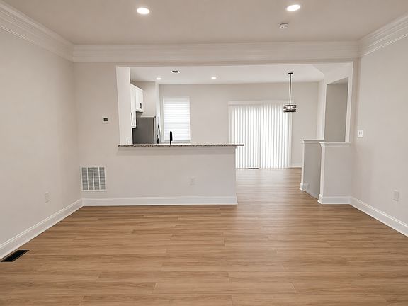 Open concept living room, kitchen and dinning room.